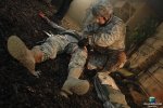 VISUAL EYES Emotive Storytelling Team captures combat medic tending to injured soldier during combat trauma scenario focused on Hemorrhage Control.