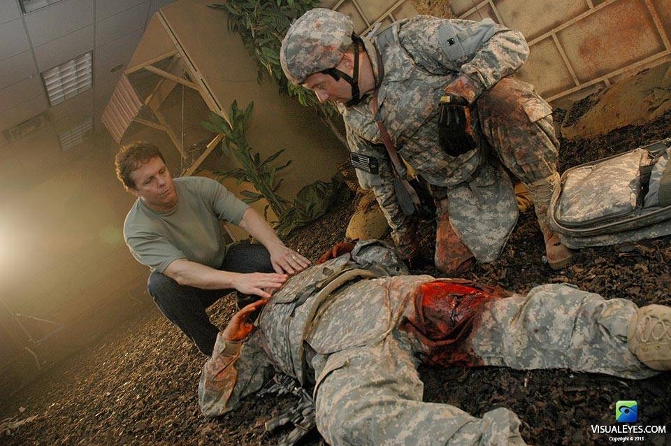 Dr. Gerard Gibbons Director VISUAL EYES Emotive Storytelling Team with combat medic and injured soldier