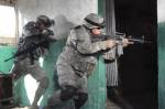 SGT Gonzales and SFC Reiley prepare a military attack