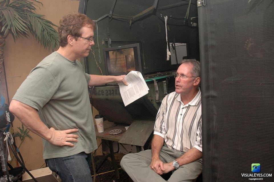 Dr. Gerard Gibbons Director VISUAL EYES Emotive Storytelling Team discusses next scene with Director of Combat Medic Training